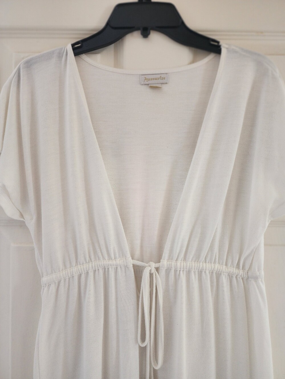 Accessorize Cream Top with Gold Logo